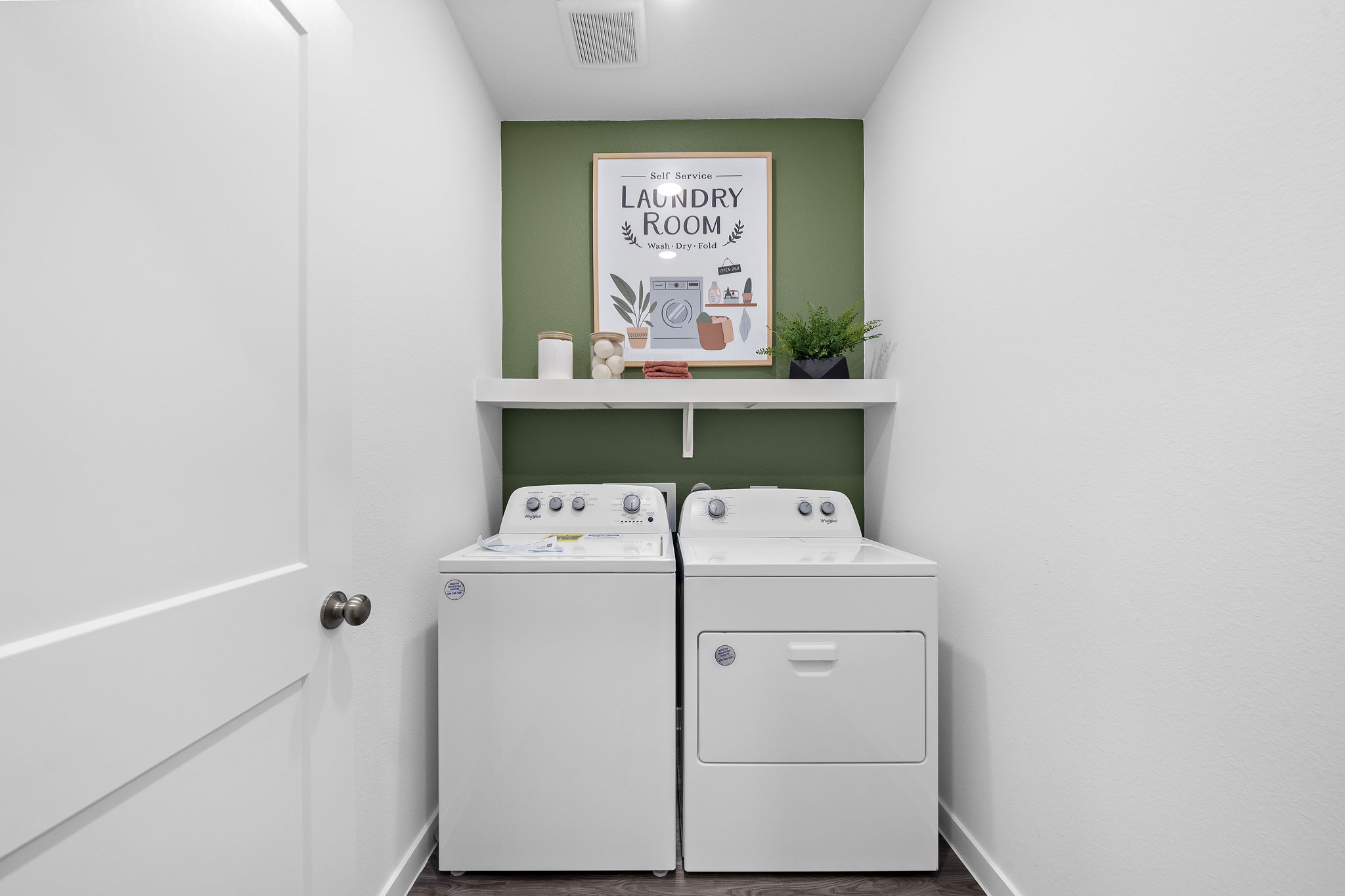 A white cabinet with a sign on it.