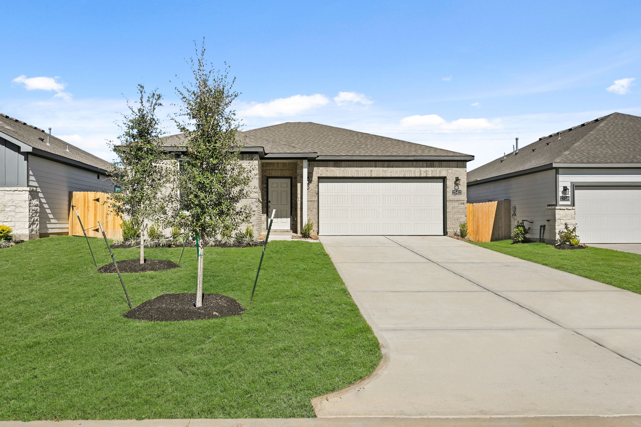 A driveway leading to a house.