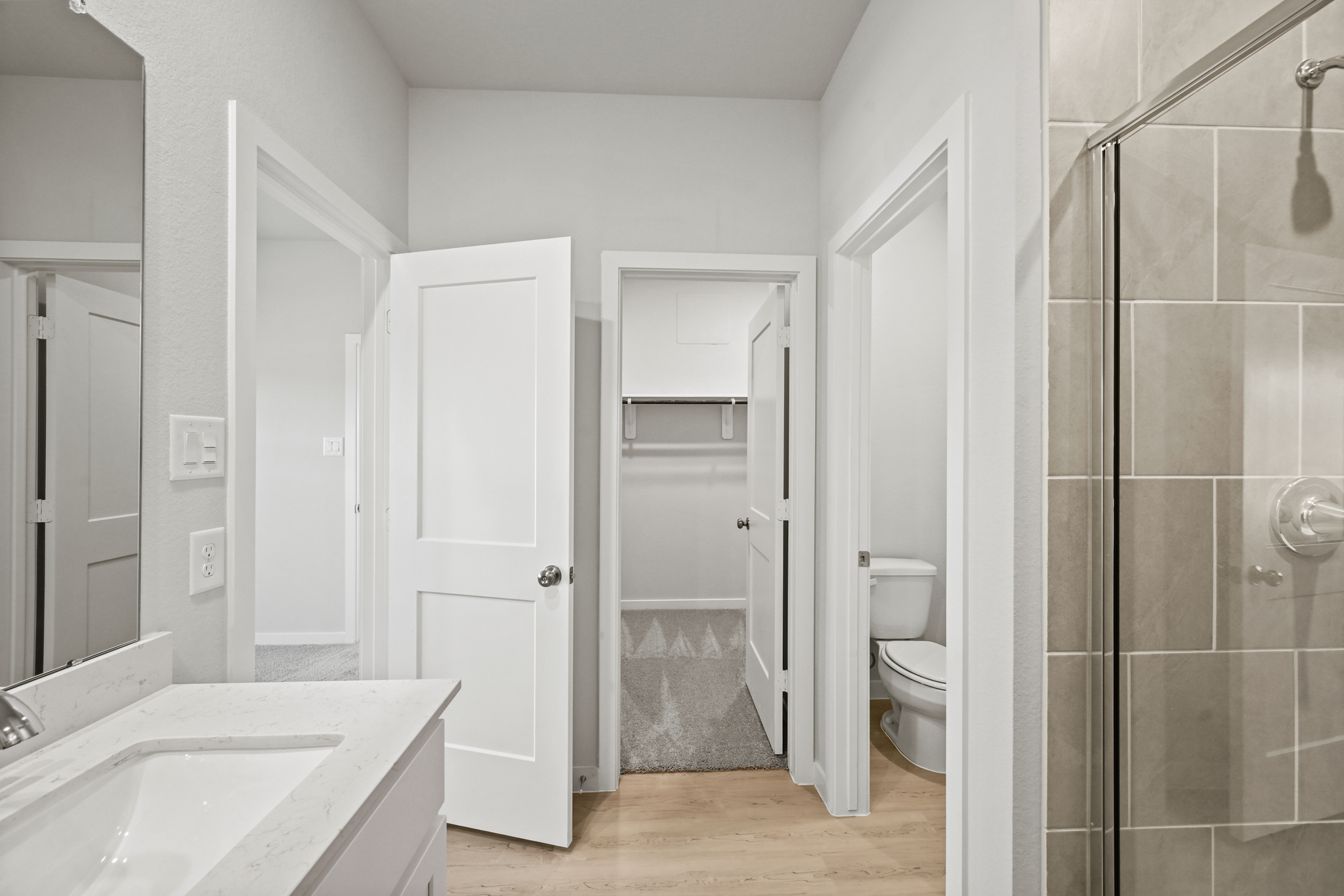 A bathroom with a glass shower.