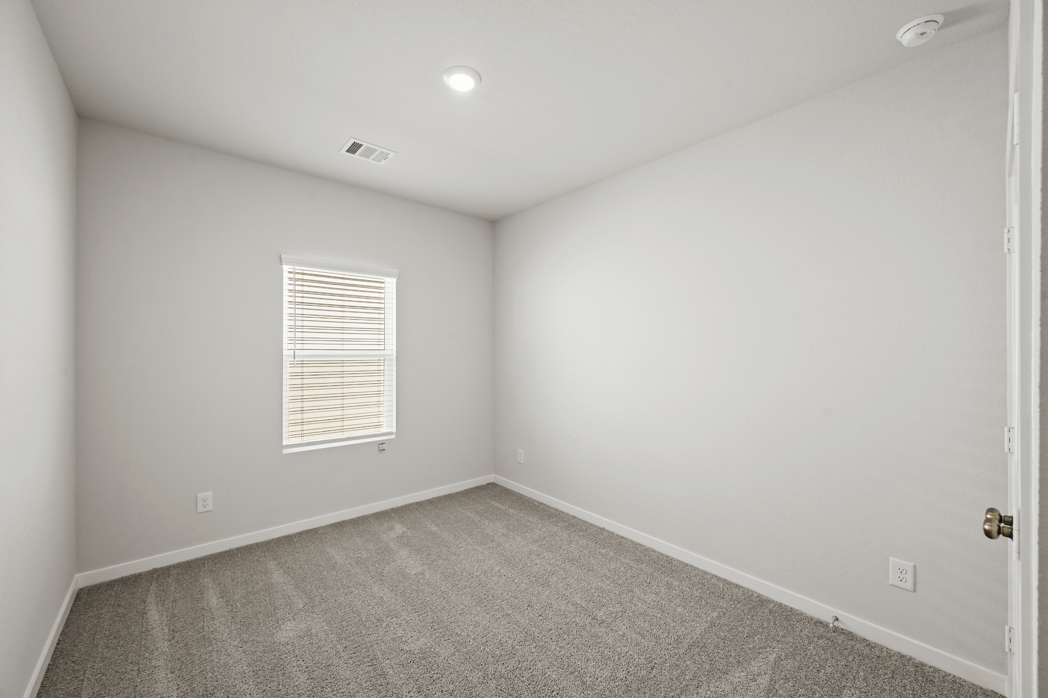 A room with a door and a window.