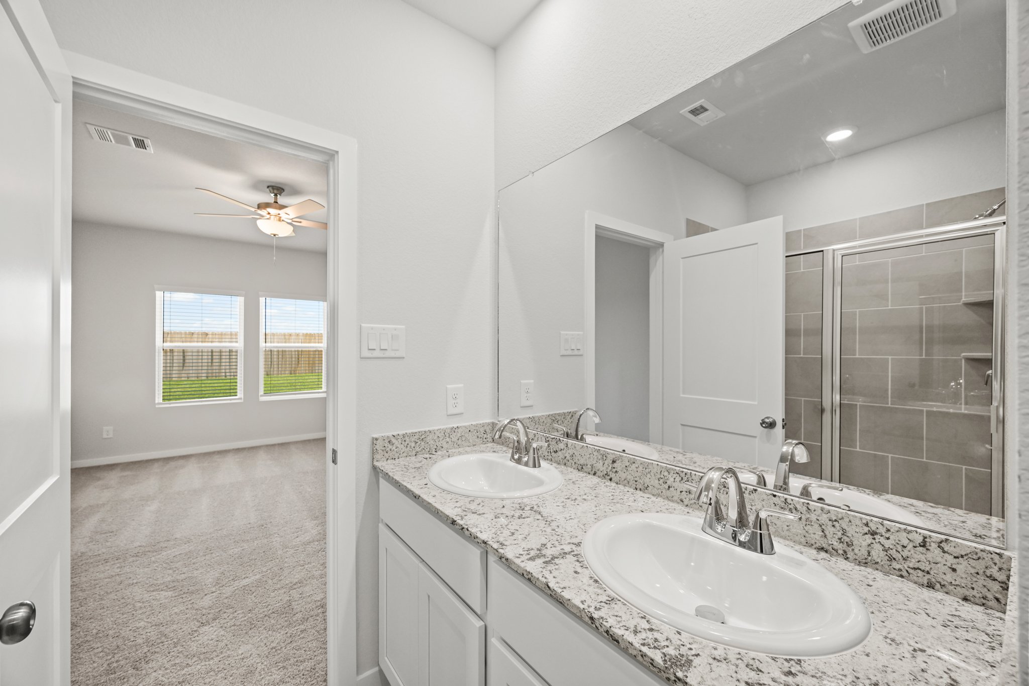 A bathroom with two sinks.