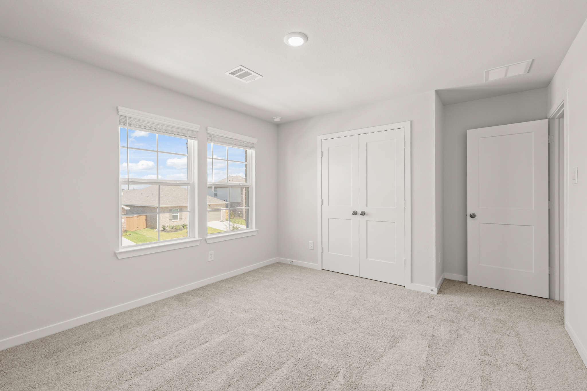 A room with white doors and windows.