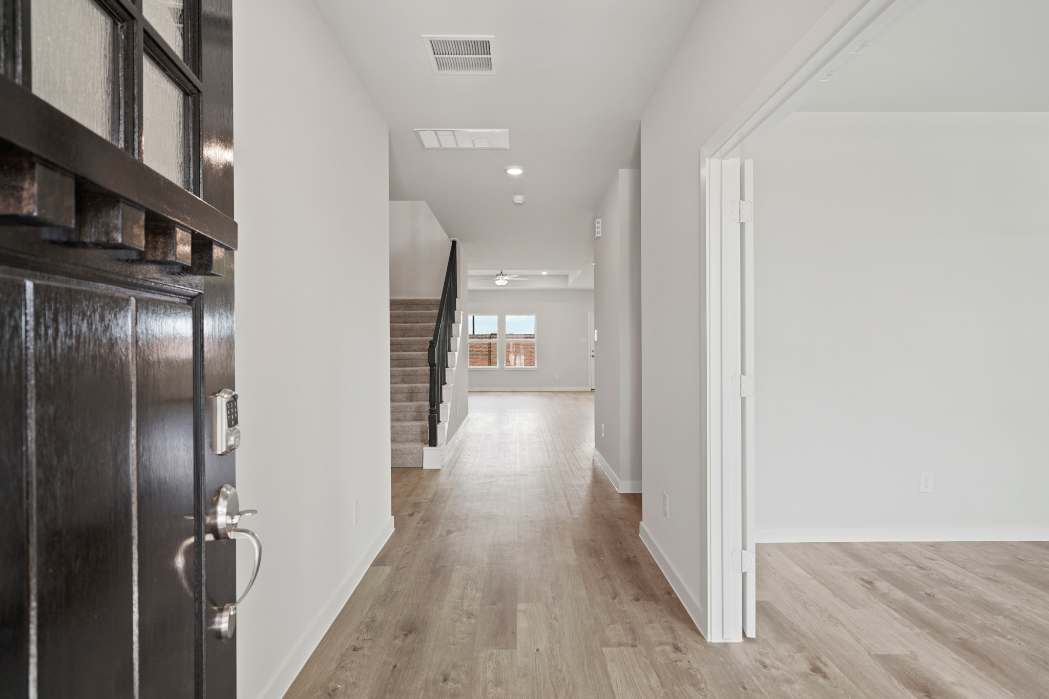 A hallway with white walls.