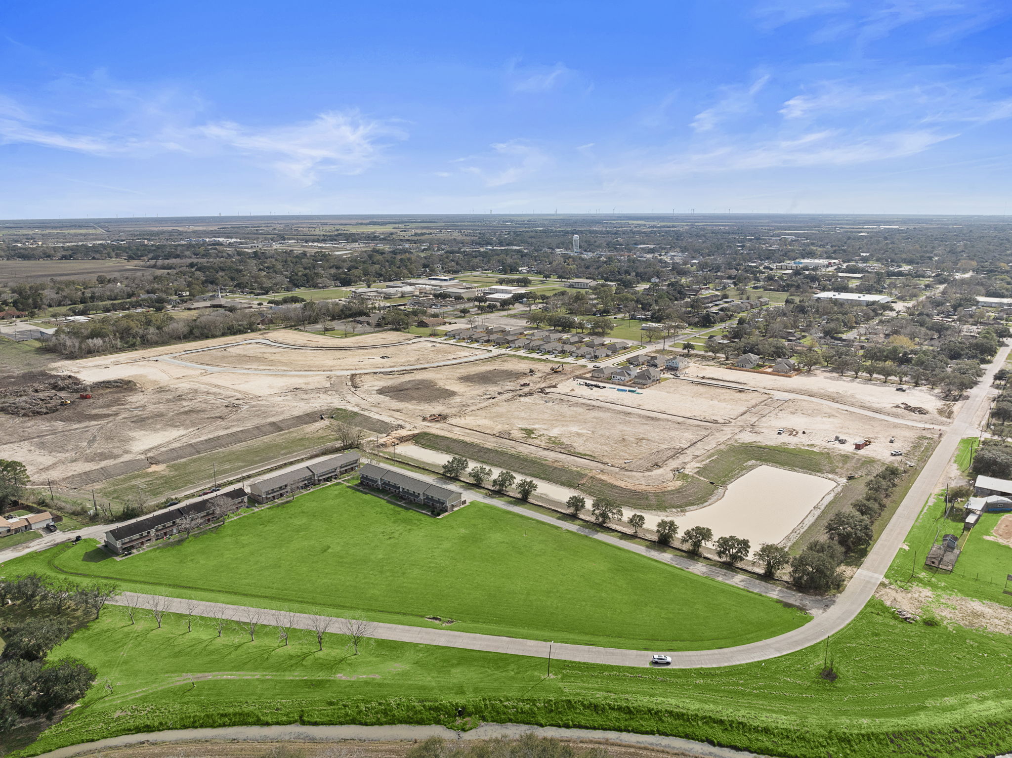 An aerial view of a large green landscape.