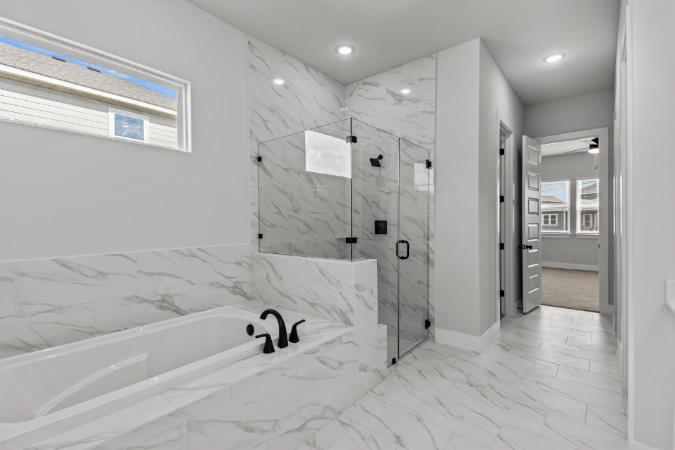 A bathroom with a large bathtub.