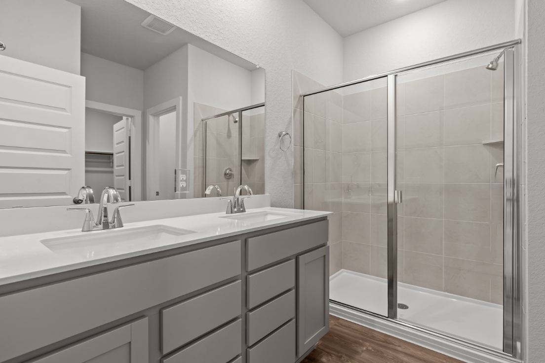 A bathroom with a glass shower.