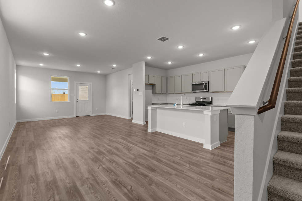 A large kitchen with white cabinets.