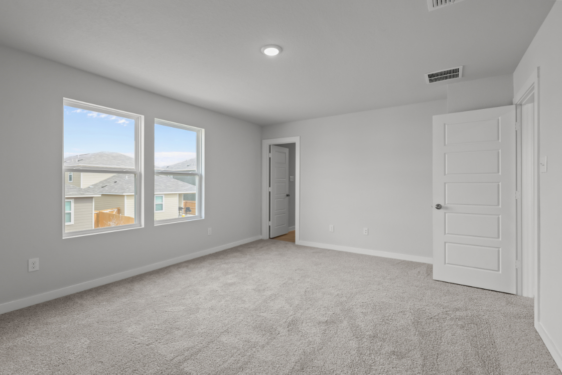 A room with white doors and a window.