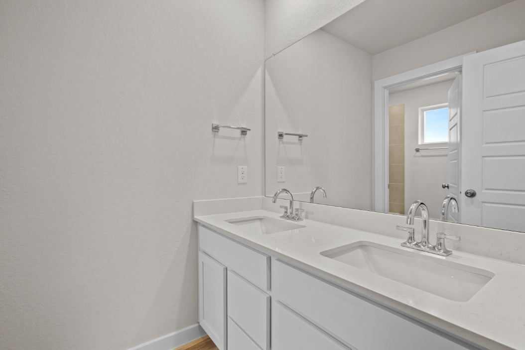 A bathroom with two sinks.