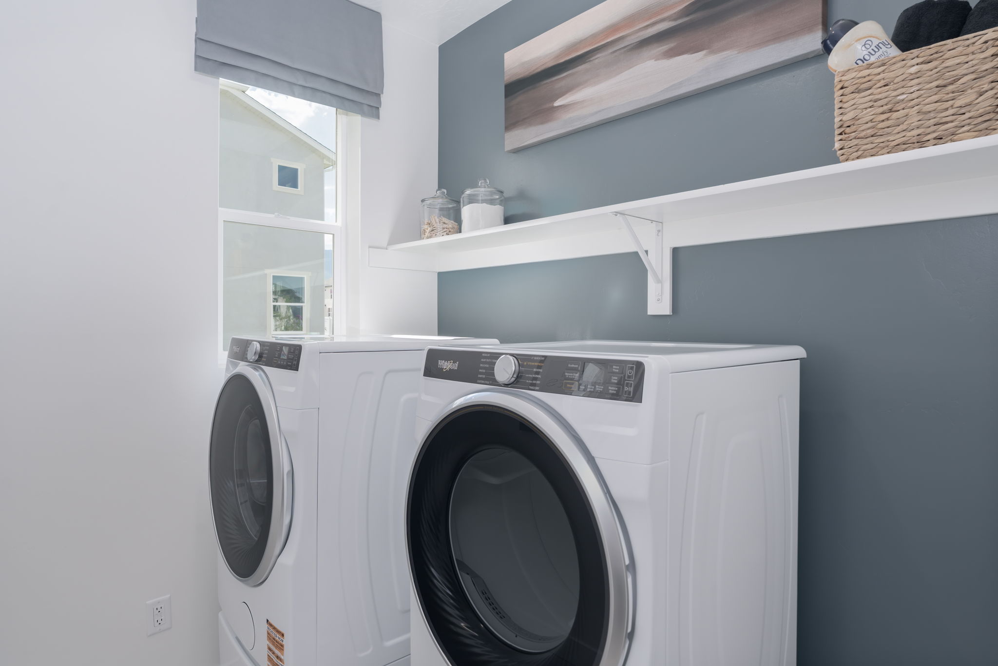 A washing machine in a room.