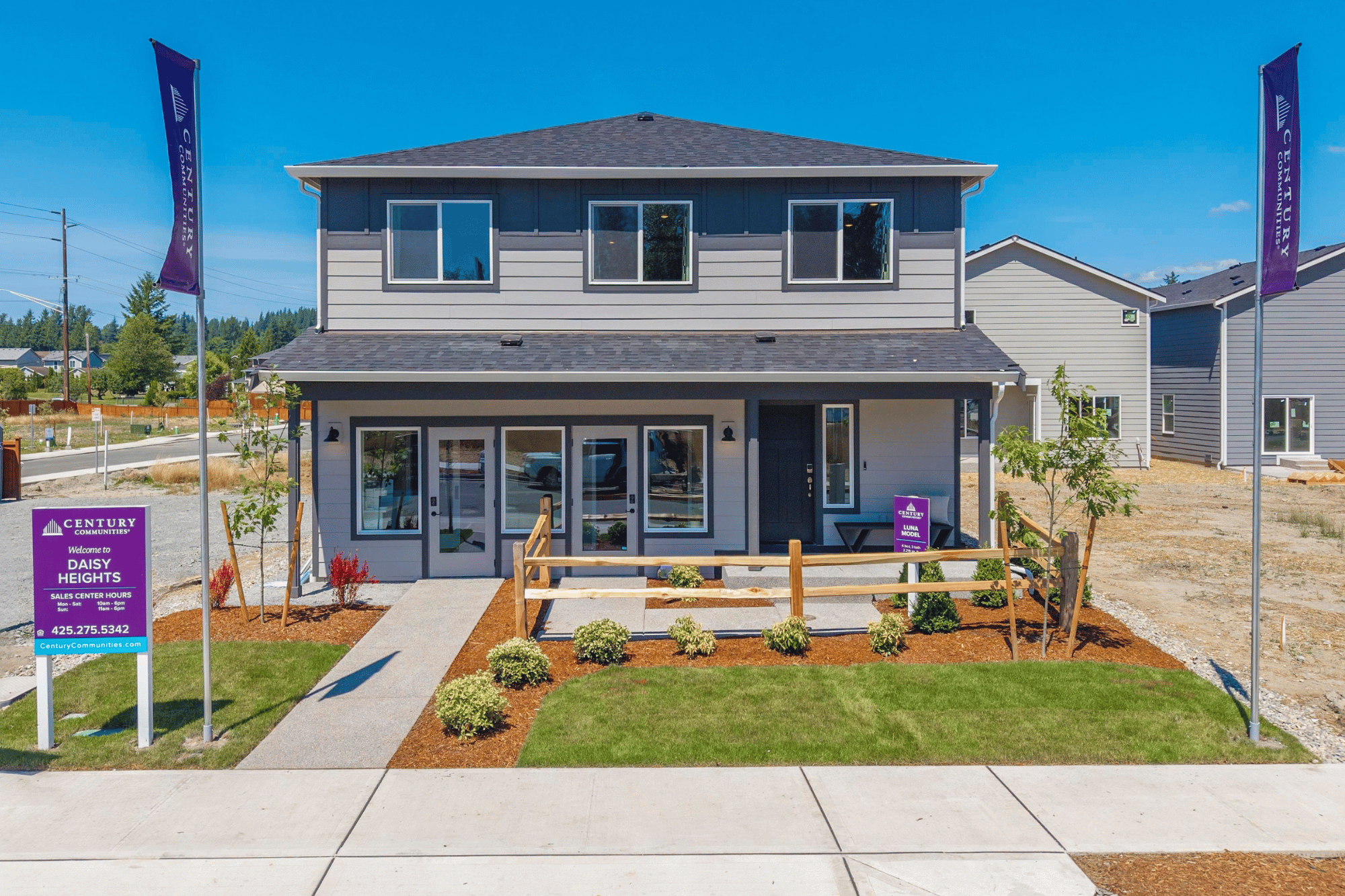 A house with a sign in front.