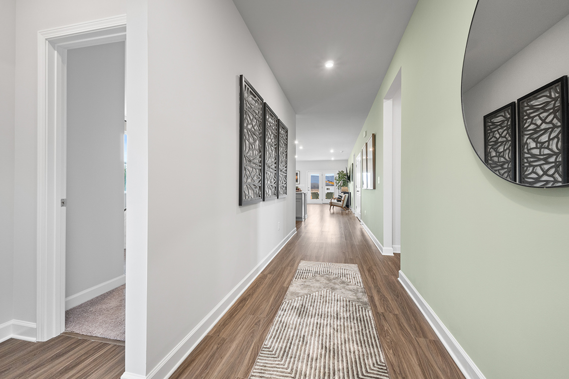 A hallway with white walls.