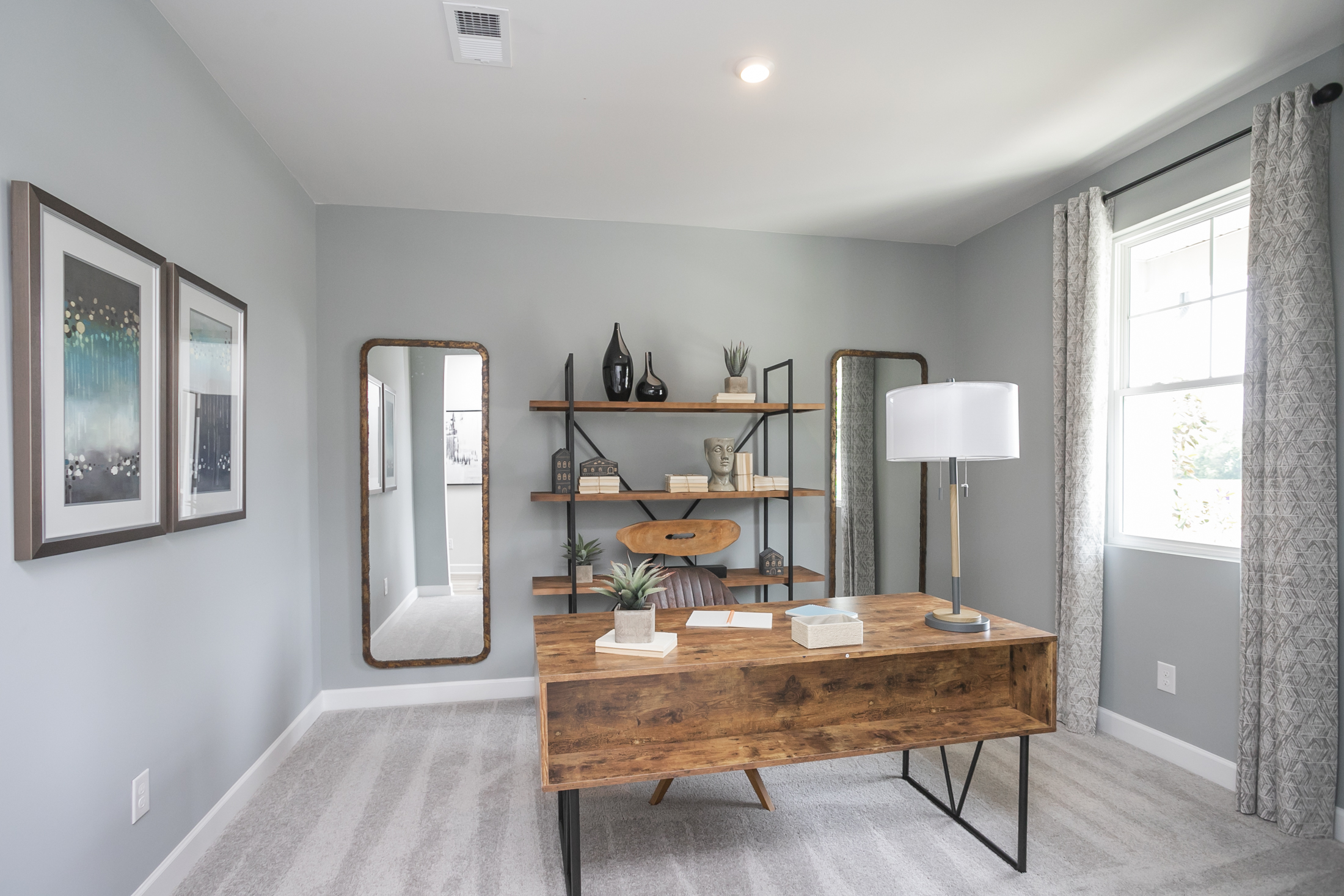 A room with a table and shelves.