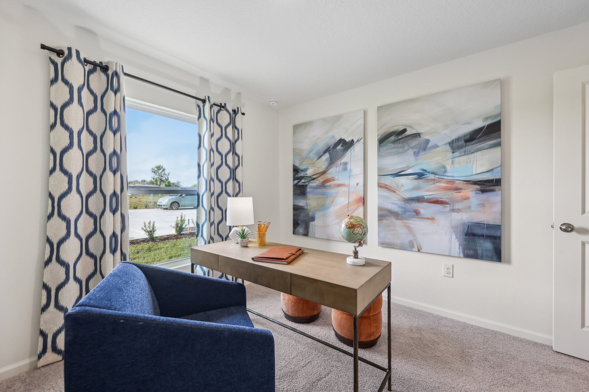 A room with a desk and a chair.