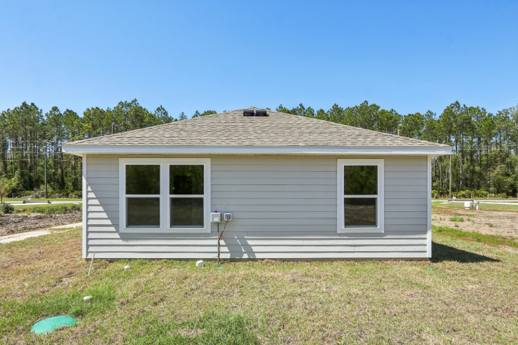 A house with a grass yard.