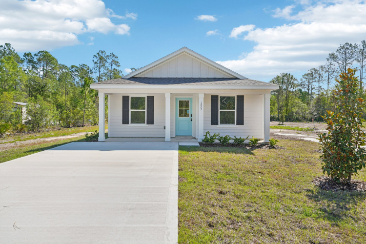 A white house with a blue door.