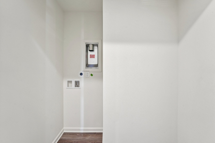 A wall with a switch and a light switch.