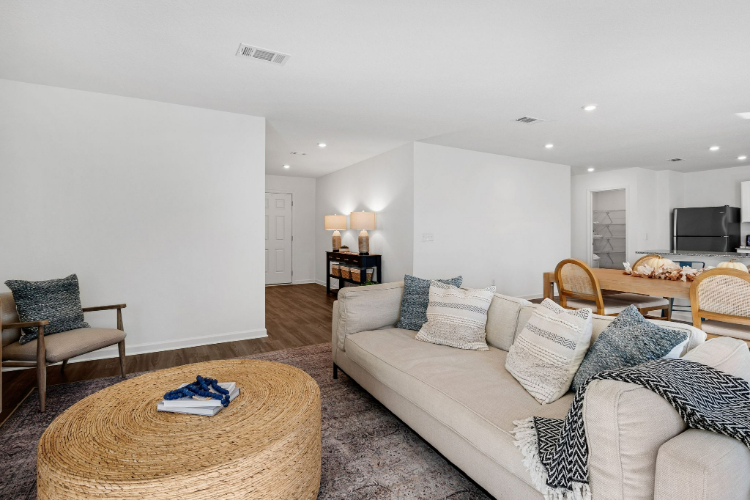 A living room with a couch and a table.