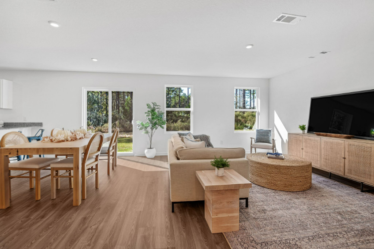 A living room with a couch and a table.