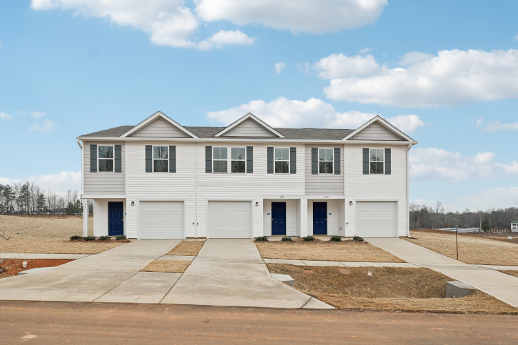A white house with blue doors.