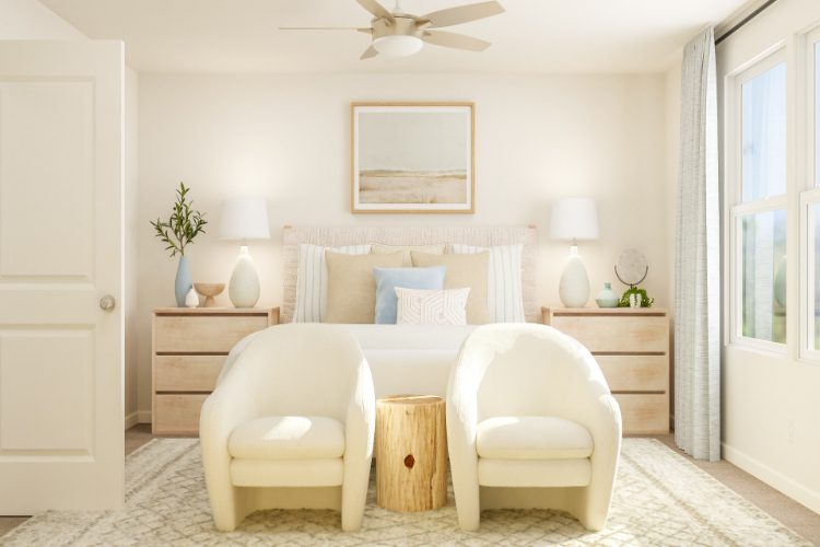 A room with a couch and chairs.