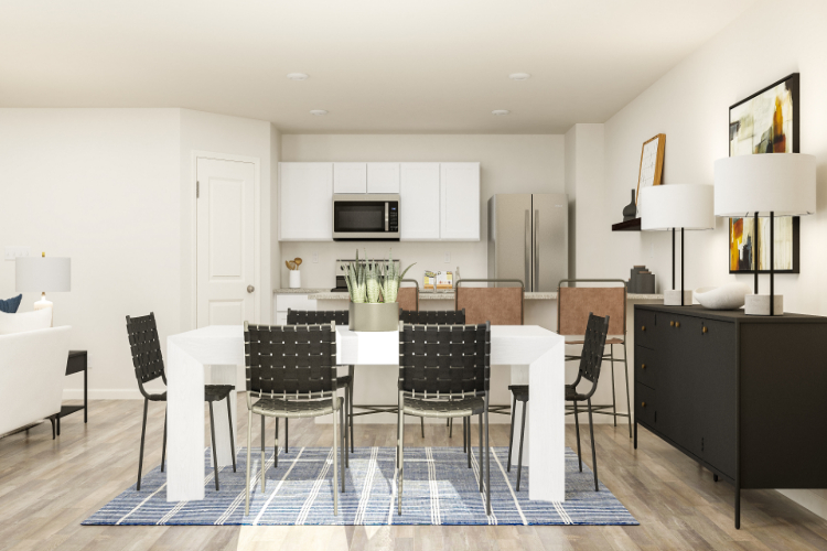 A kitchen with a dining table and chairs.